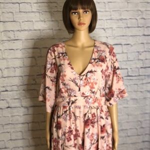 Beautiful peach floral maxi romper.